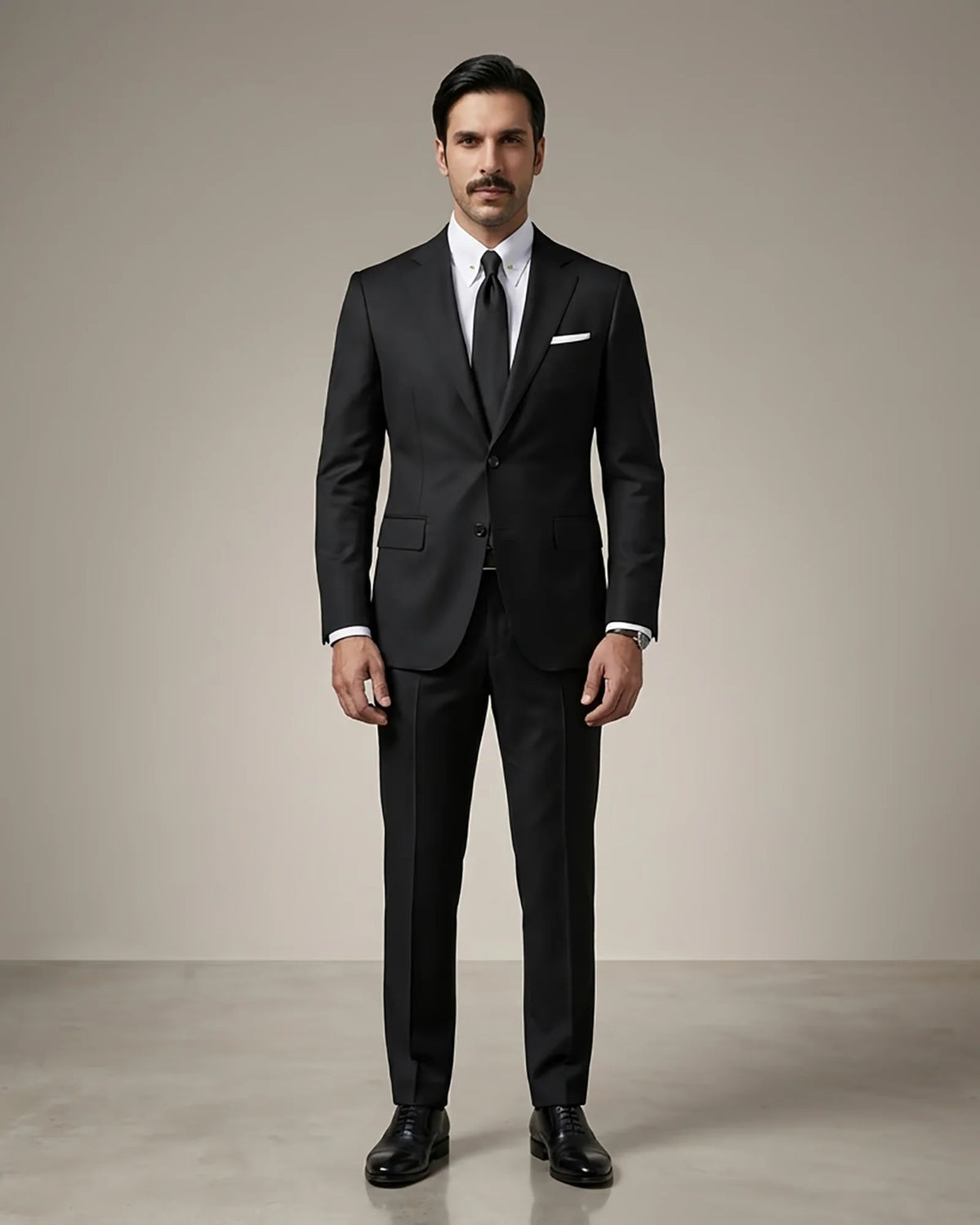 Man wearing a black Italian wool two-button notch lapel suit with a white shirt and black tie