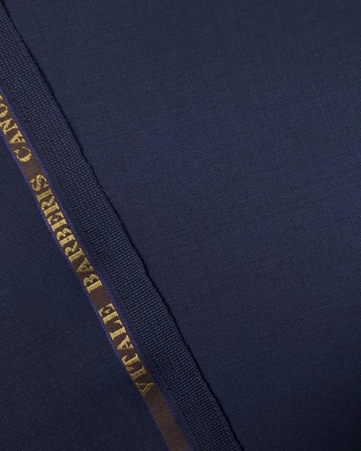 Navy Vitale Barberis Canonico Super 110s wool suit fabric with the mill selvedge, close-up