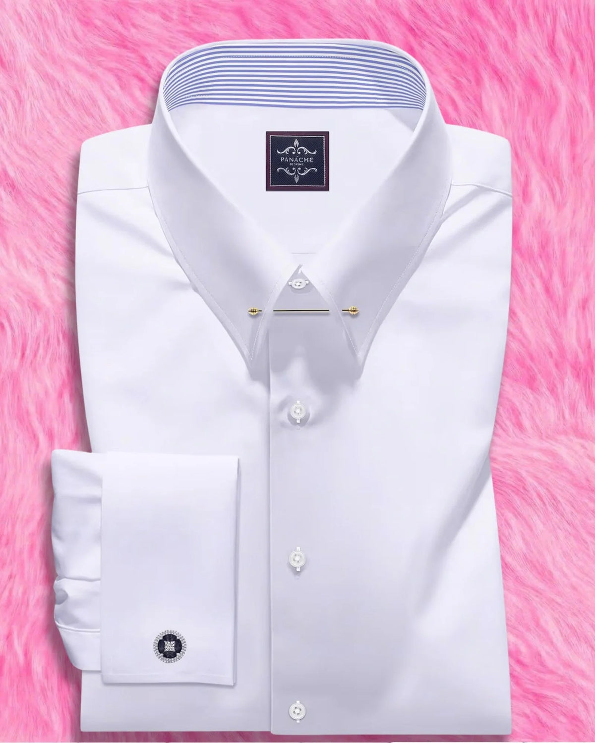 White pin collar dress shirt for men with gold collar bar and French cuffs, folded